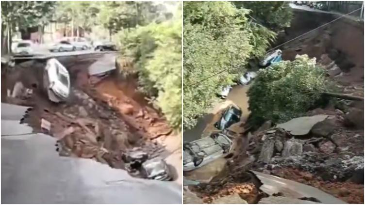 Vehículos junto a un enorme socavón tras el colapso de una carretera en Kunming, China